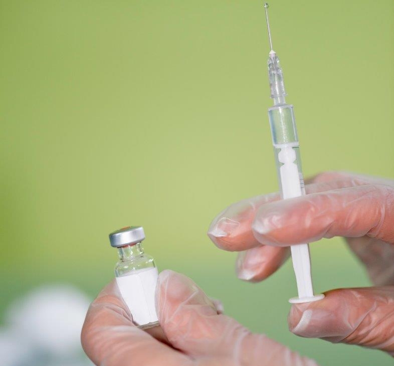  A syringe is being prepared for vaccination